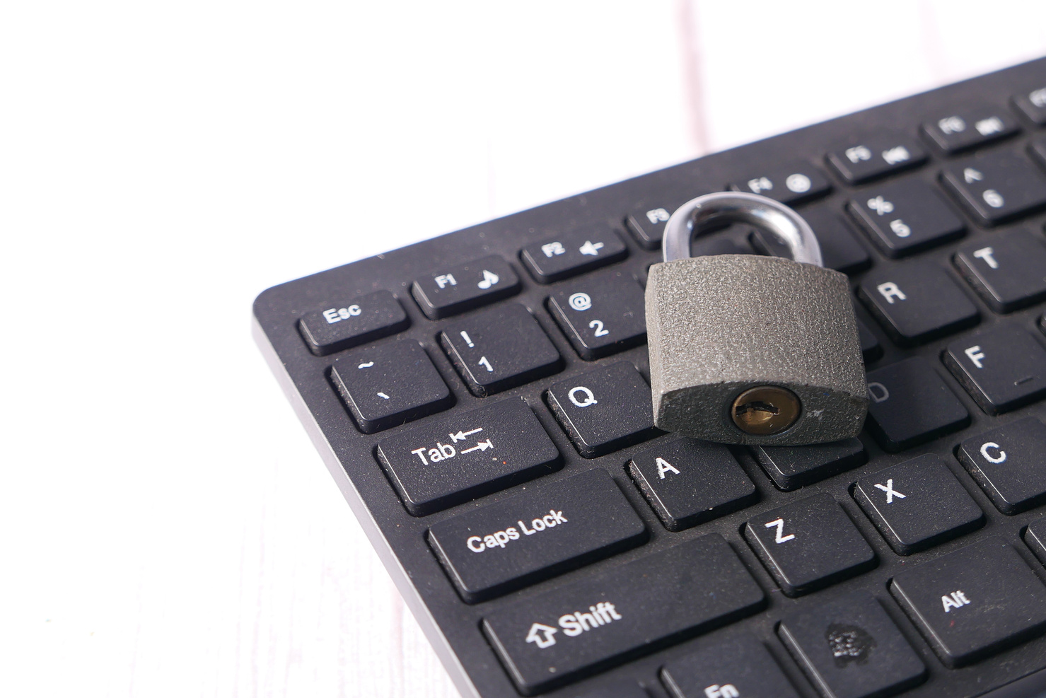 Internet Safety Concept with Padlocked on Computer Keyboard